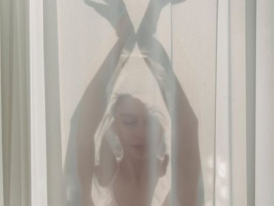 Gentle stretching pose in soft morning light.